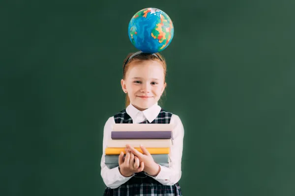 little-redhead-schoolgirl-with-globe-on-head-holdi-2026-01-06-00-12-59-utc-697b9b18122d4