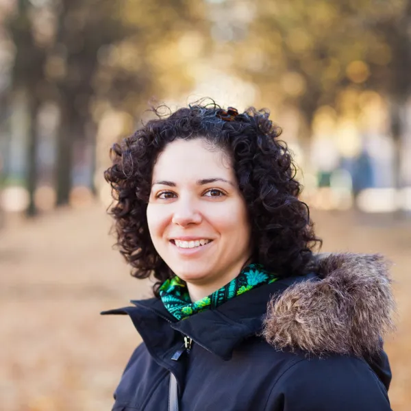 portrait-of-happy-woman-with-curly-hair-at-park-2024-10-18-04-16-23-utc-6931905bc47e0