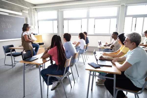 teacher-explaining-lesson-to-diverse-group-of-high-2025-08-26-09-03-19-utc-6931902d13f04